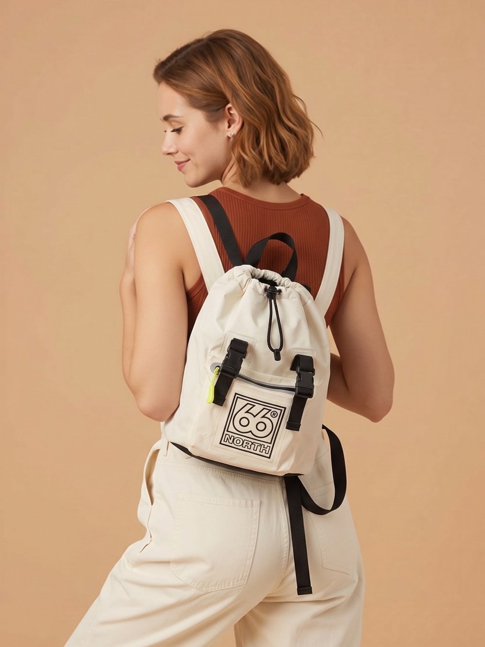 66 North Iceland Cream faux leather Backpack w zippered front pocket.